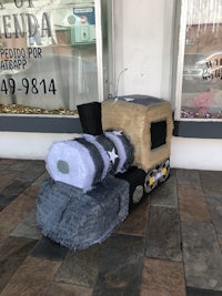 a pinata sitting outside of a store