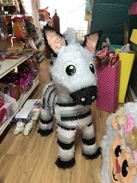 a zebra pinata is on display in a store