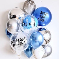 a bunch of balloons with the words father hero