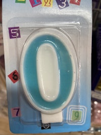 a blue and white toothbrush in a package